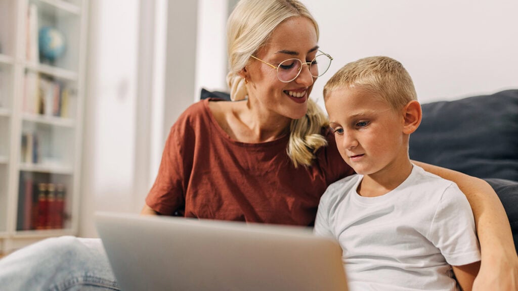 Family attending an telehealth behaviour support session from home.