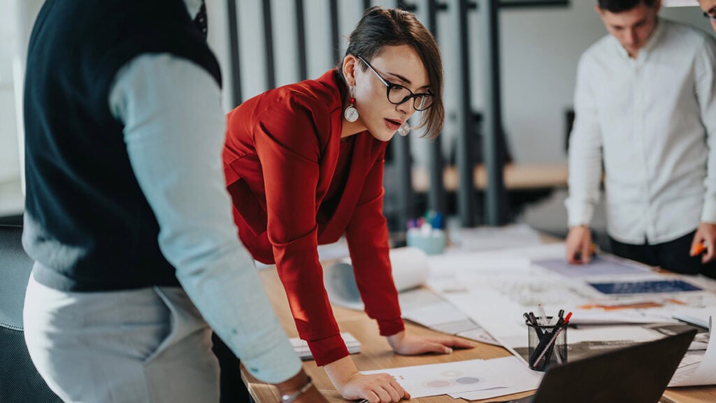 Brisbane professionals managing workplace stress with resilience and wellbeing strategies in a supportive work environment.