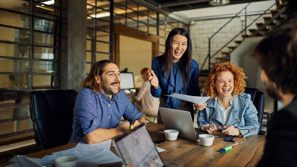 Team collaborating in a modern Brisbane office – workplace challenges, resilience and communication strategies.