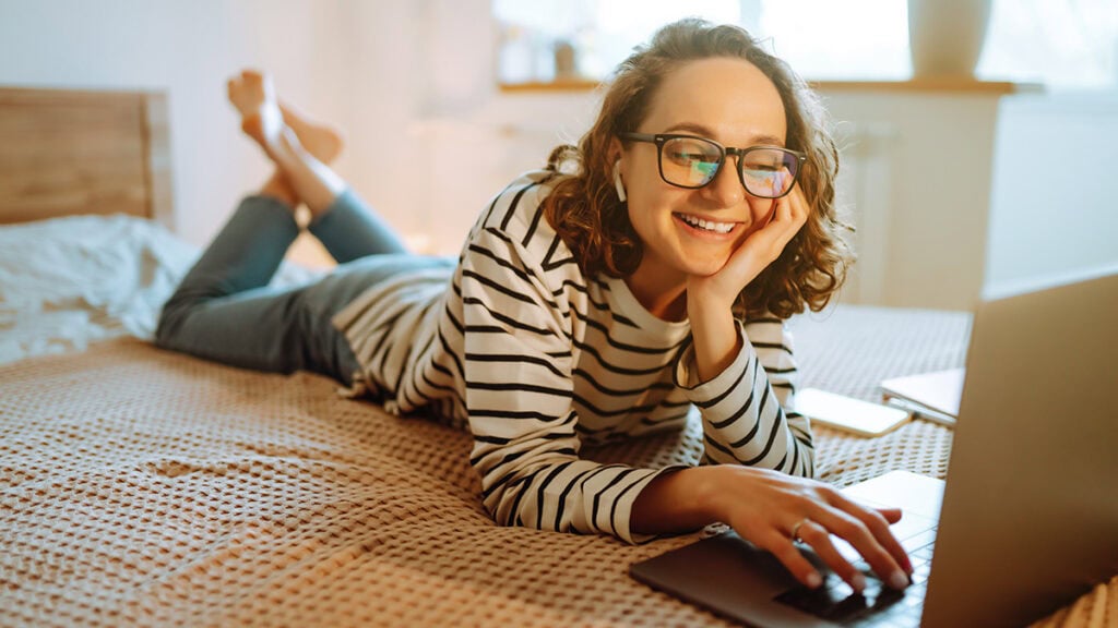 Woman taking part in a telehealth positive behaviour support session at home